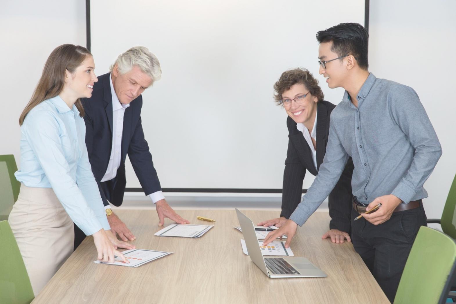 Professional presenting financial charts and analysis to business team